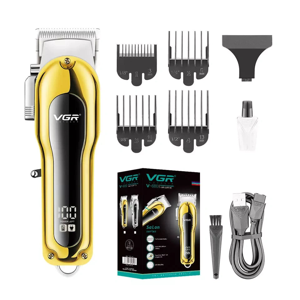 Two VGR V-680 hair clipper trimmers, one silver and one gold, with LED displays, placed on a dark marble surface.