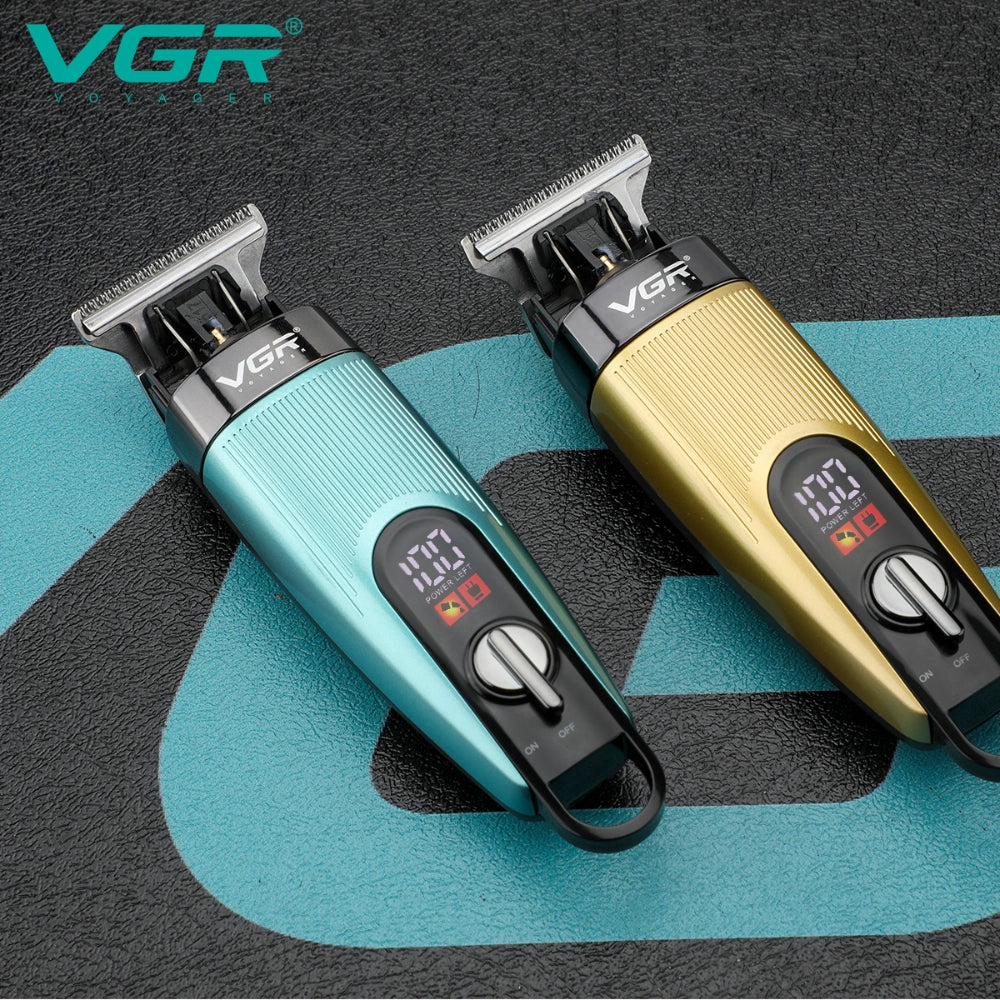 VGR V-975 Professional Salon Series Hair Trimmer in teal color with various accessories including guide combs and a USB charging cable, displayed alongside its packaging box.